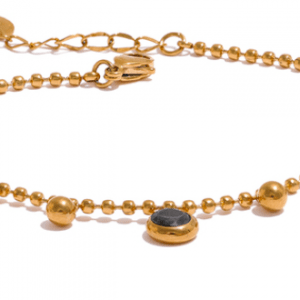 Pulsera acero dorada con circonitas negras