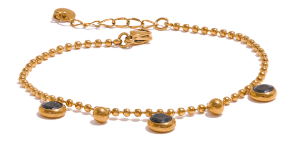 Pulsera acero dorada con circonitas negras