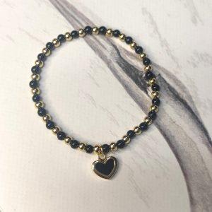 Pulsera elástica bolas doradas y mineral ónix con charm en forma de corazón