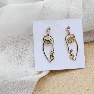 pendientes acero dorado en forma de cara