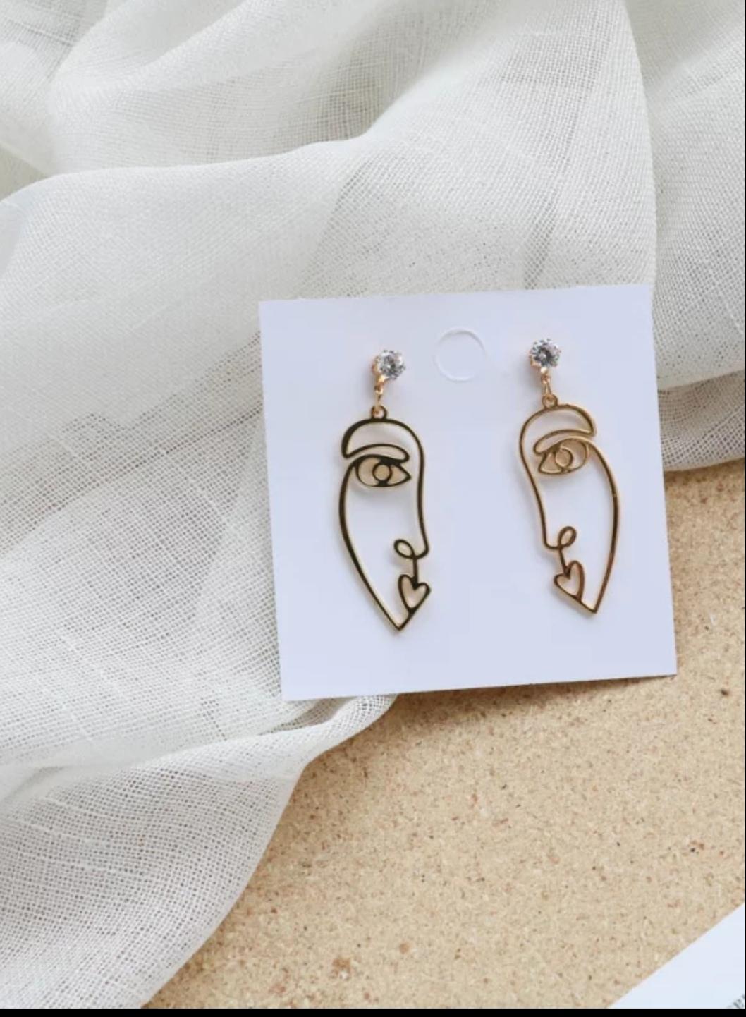 pendientes acero dorado en forma de cara pendientes acero dorado en forma de cara